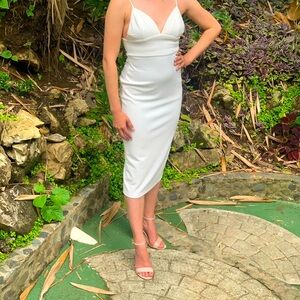 White, midi length, body con. Perfect for rehearsal dinner/bachelorette party